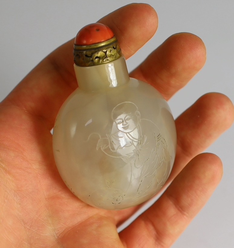 A Chinese agate ‘boys’ snuff bottle, 19th century 5.5cm high, brass and coral stopper